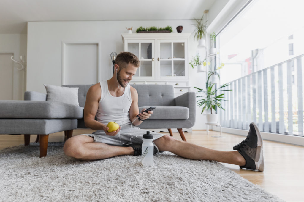 Handsome man working out at home