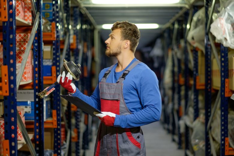 Worker on a automotive spare parts warehouse